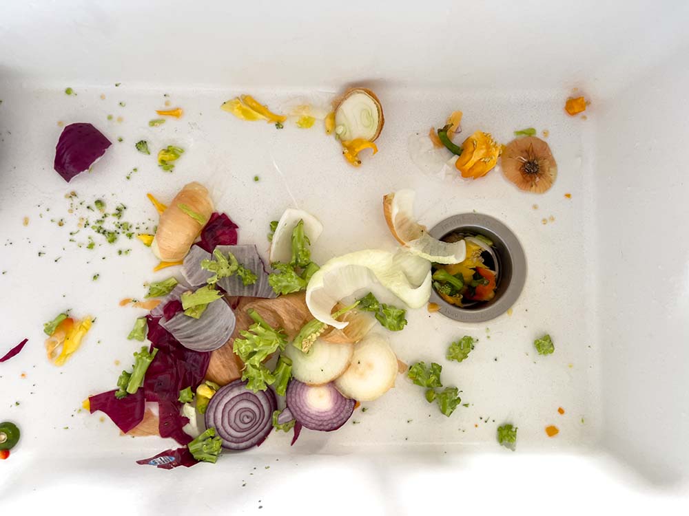 vegetable scraps in sink ready for disposal vegetable scraps in sink ready for disposal