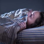 woman under the bed covers