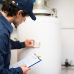 plumber checking a water heater
