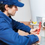 plumber working on a water heater
