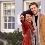 man and woman with keys to their house