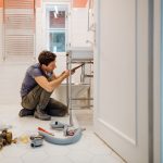 EJ Plumber fixing a bathroom sink