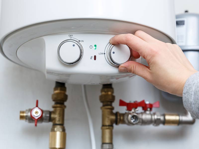 Person Adjust Water Heater Temperature