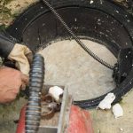 Plumber repairing clogged grease trap Los Altos Hills, CA