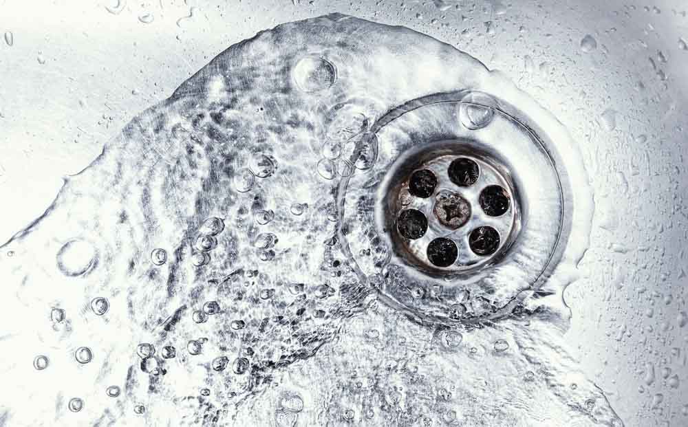 Water flowing down the drain