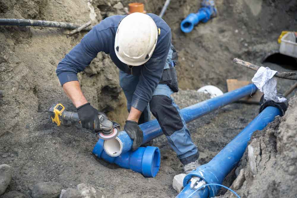 EJ technician working on a home repiping project