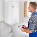 EJ technician working on tankless water heater repairs