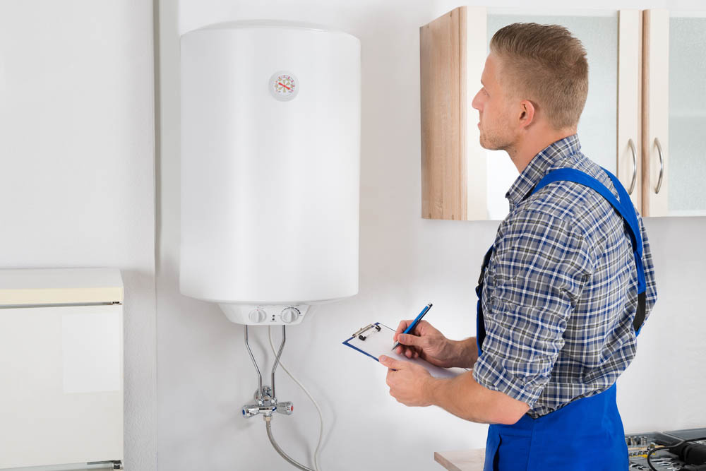 EJ technician working on tankless water heater repairs