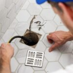 EJ technician hydro jetting a drain