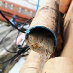 pipe cut-away of grease buildup forming a blockage