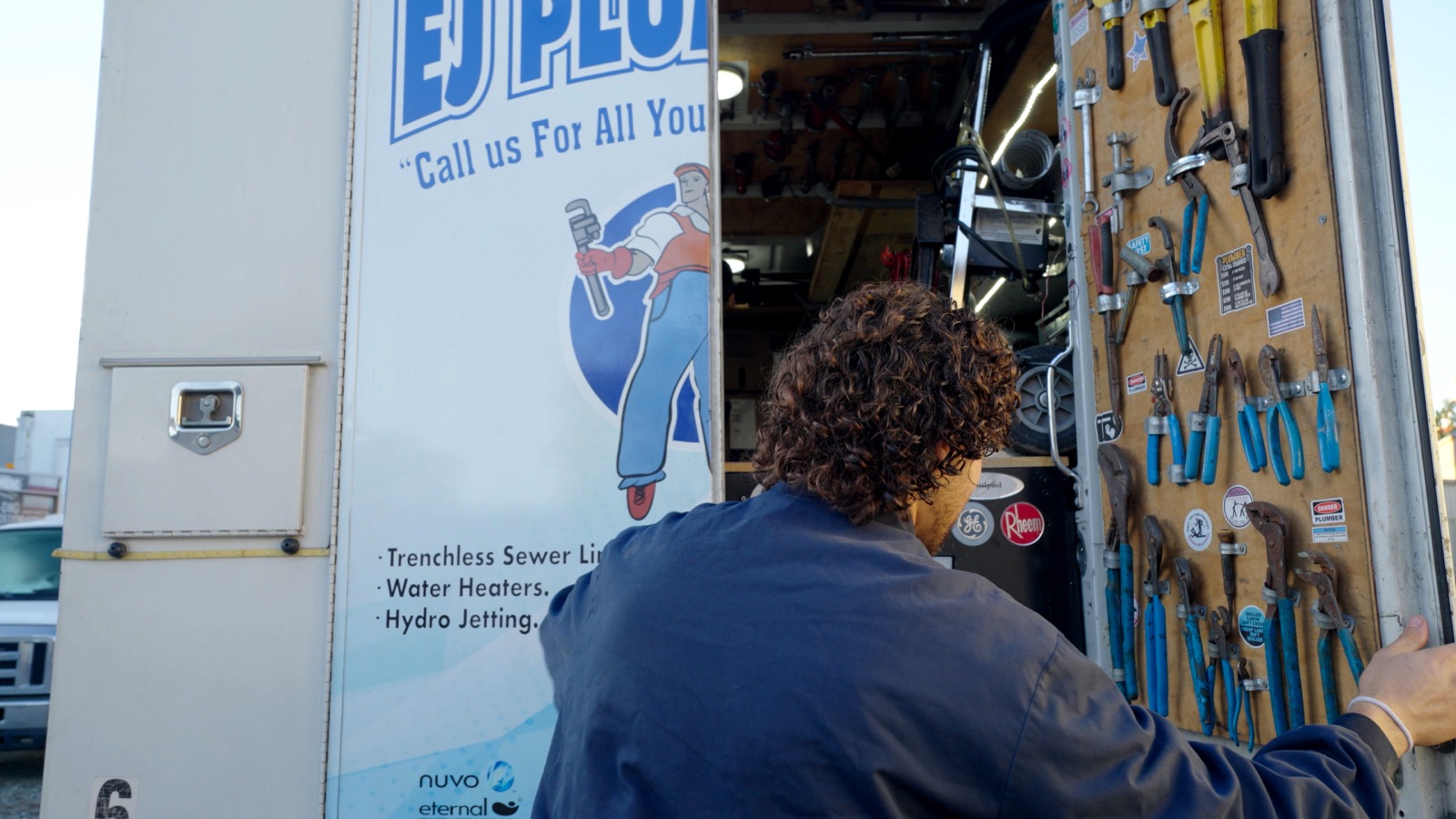 EJ service technician selecting tools from a fully stocked truck